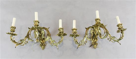 A pair of ormolu three light wall appliques, height 10in. depth 15in.